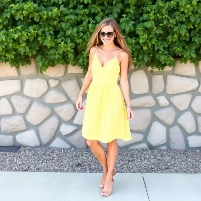 Playful yellow sundress paired with relaxed sandals for a bright and casual look.