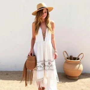 Woman wearing a stylish boho outfit with flowy fabrics, earthy tones, and vintage-inspired accessories, embracing a free-spirited look.